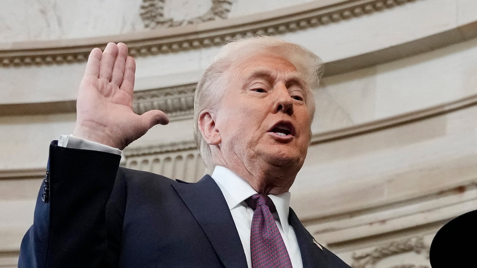 TOPSHOT - Donald Trump is sworn in as the 47th president of the United States by Chief Justice John Roberts as Melania Trump holds the Bible during the 60th Presidential Inauguration in the Rotunda of the U.S. Capitol in Washington, Monday, Jan. 20, 2025. (Photo by Morry Gash / AFP) (Photo by MORRY GASH/AFP via Getty Images)