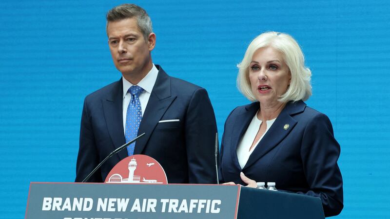 U.S. National Transportation Safety Board (NTSB) Chairman Jennifer Homendy stands with Transportation Secretary Sean Duffy as he launches an air traffic control infrastructure plan during an event at the Transportation Department in Washington, D.C., U.S., May 8, 2025. REUTERS/Jonathan Ernst