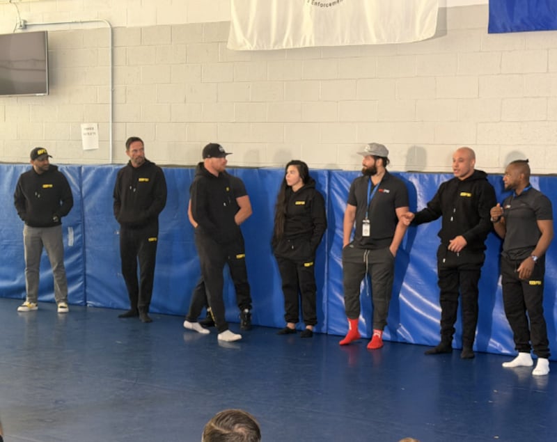 Patel (far left) appeared to be wearing personalized Nike shoes at the FBI-UFC training event last weekend.