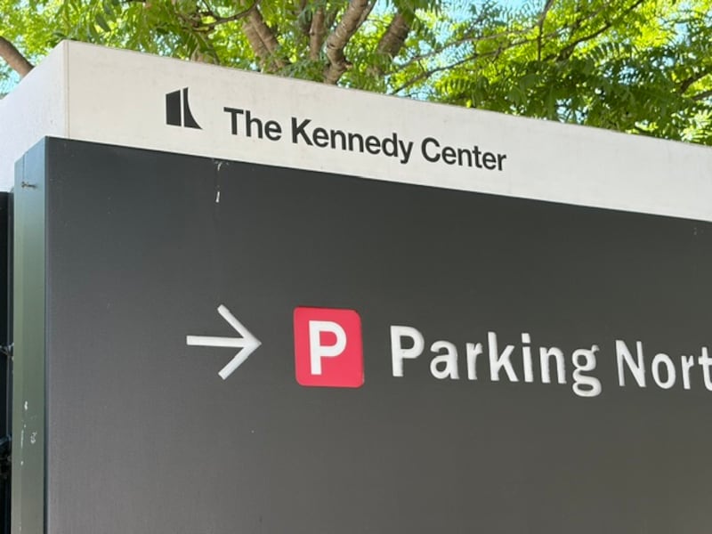 A parking sign at the Kennedy Center does not include a reference to President Donald Trump after a federal judge ruled only Congress has the power to change the center's name and ordered Trump's name be removed from all signage and material.