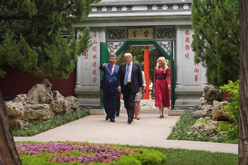 President Donald Trump talks with China’s President Xi Jinping at the Zhongnanhai leadership compound, Friday, May 15, 2026, in Beijing.  Mark Schiefelbein/Pool via REUTERS
