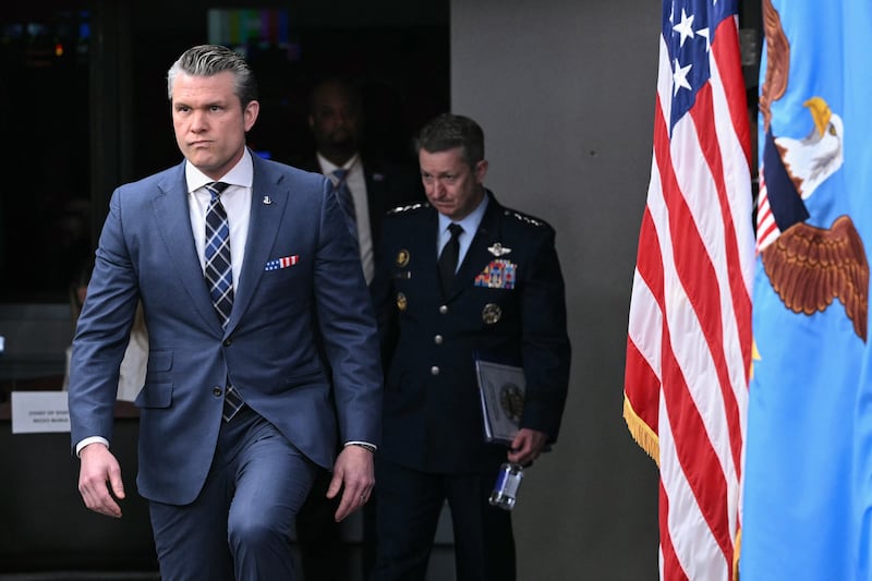 Secretary of Defense Pete Hegseth and Chairman of the Joint Chiefs of Staff General Dan Caine arrive for a news conference at the Pentagon in Washington, DC, on March 19, 2026.