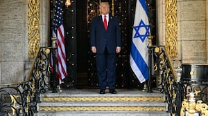 US President Donald Trump waits for the arrival of Israeli Prime Minister Benjamin Netanyahu at Trump's Mar-a-Lago residence in Palm Beach, Florida, on December 29, 2025. (Photo by Jim WATSON / AFP via Getty Images)