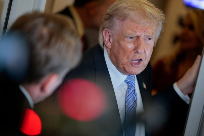U.S. President Donald Trump speaks to the press aboard Air Force One enroute to the U.S.  following his official visit with President Xi Jinping in China, May 15, 2026. REUTERS/Evan Vucci