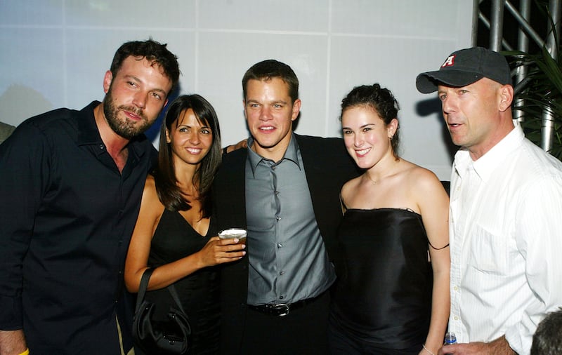 Actor Bruce Willis, his daughter Rumer Willis, actor Matt Damon, his girlfriend Luciana Bozan (nee Barroso) and actor Ben Affleck pose at the after party for the premiere of Universal's "The Bourne Supremacy" at Sunset+Vine on July 15, 2004 in Los Angeles, California.