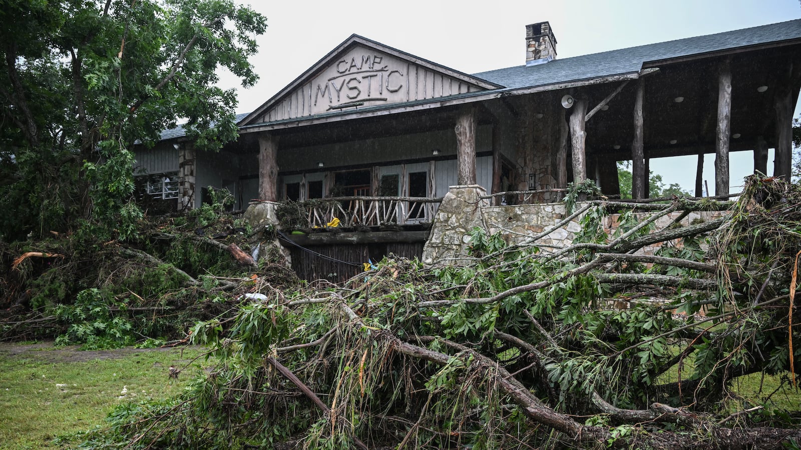 A view of Camp Mystic, the site of where at least 20 girls went missing after flash flooding in Hunt, Texas, on July 5, 2025. Rescuers were on Saturday searching for more than 20 girls missing from a riverside summer camp in the US state of Texas, after torrential rains caused devastating flooding that killed at least 27 people -- with more rain on the way. "So far, we've evacuated over 850 uninjured people, eight injured people and have recovered 27 deceased fatalities at this time. Of these 27, 18 are adults, nine are children," said Kerr Country Sheriff Larry Leitha on July 5. (Photo by RONALDO SCHEMIDT / AFP) (Photo by RONALDO SCHEMIDT/AFP via Getty Images)