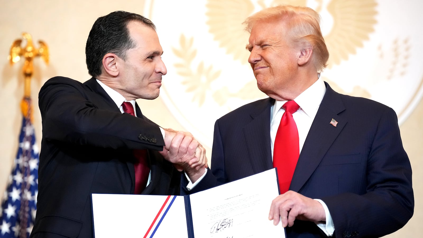 Entra1 CEO Wadie Habboush and U.S. President Donald Trump shake hands