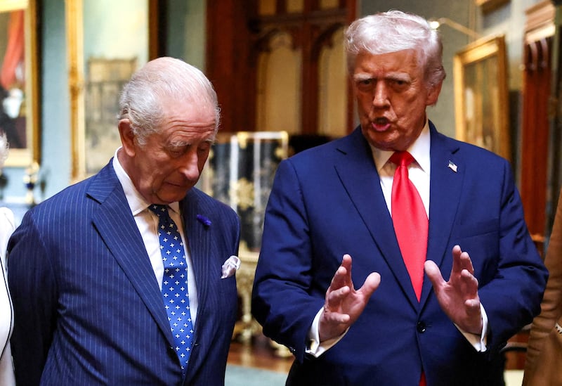 King Charles III talks with Trump during a formal farewell at the U.K.'s Windsor Castle last September. Trump was charmed by the pageantry of the state visit, and immediately planned on inviting the monarch to the U.S.