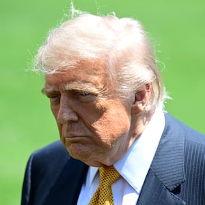 WASHINGTON, UNITED STATES - MAY 12: U.S. President Donald Trump speaks to members of the press before boarding Marine One on the South Lawn of the White House in Washington, United States, on May 12, 2026. (Photo by Kyle Mazza/Anadolu via Getty Images)