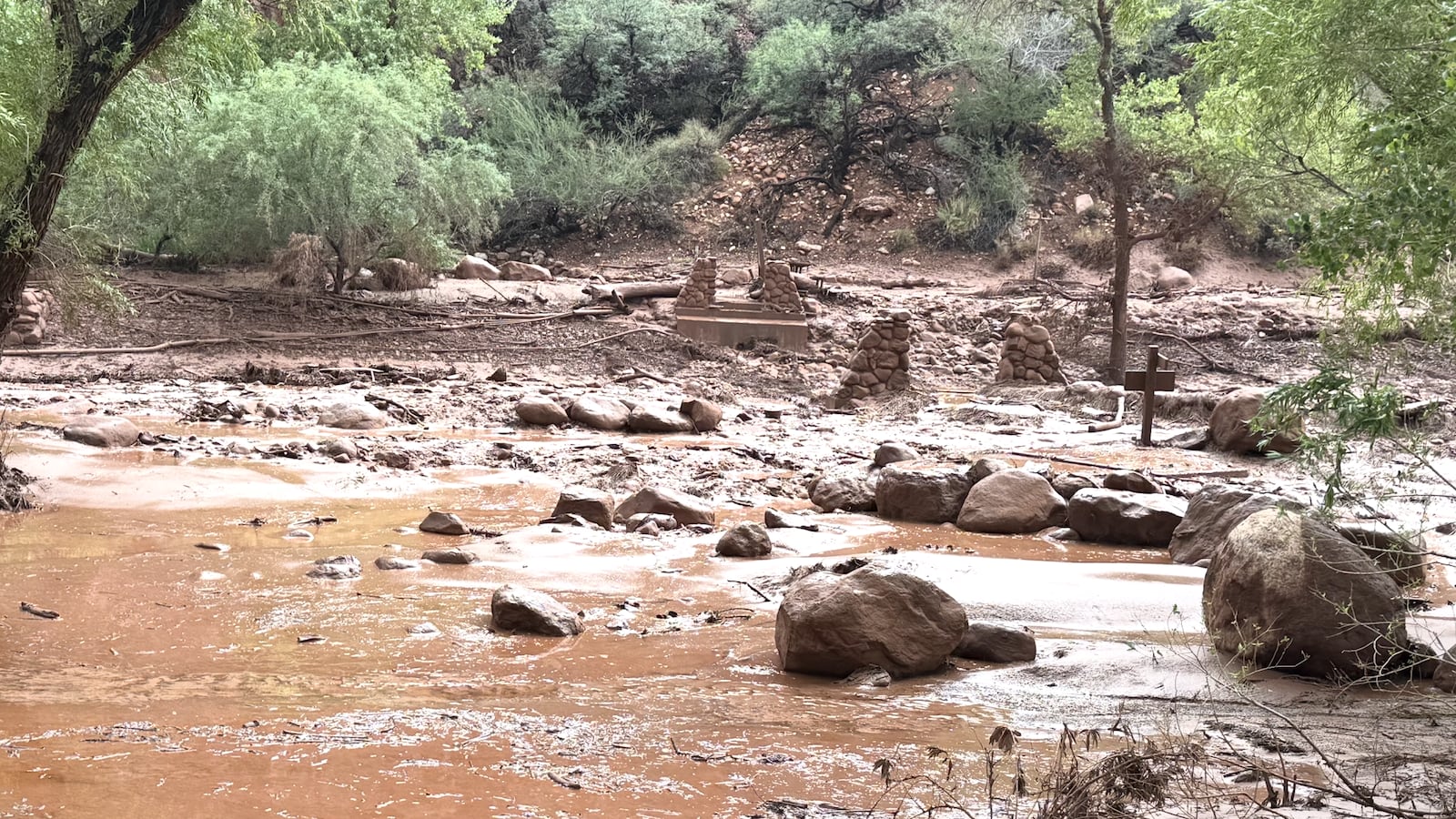 Remnants of stone bridge pylons remain along Bright Angel Creek following a flash flood that destroyed the footbridge on August 29. The flooding caused significant damage to infrastructure throughout the canyon.