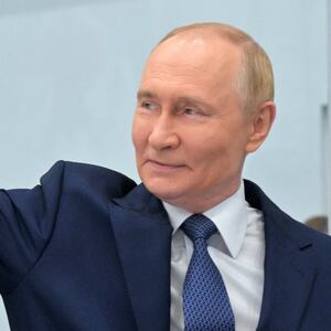 Russia's President Vladimir Putin waves as he visits a plant of Omega-Sea entreprise in the far eastern port city of Magadan on the Sea of Okhotsk on August 15, 2025, on his way to Alaska to meet with US' President.