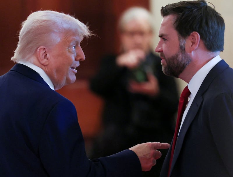 U.S. President Donald Trump talks with Vice President JD Vance in the Cross Hall following a celebration of U.S. military mothers at the White House in Washington, D.C., U.S., May 8, 2025. REUTERS/Leah Millis