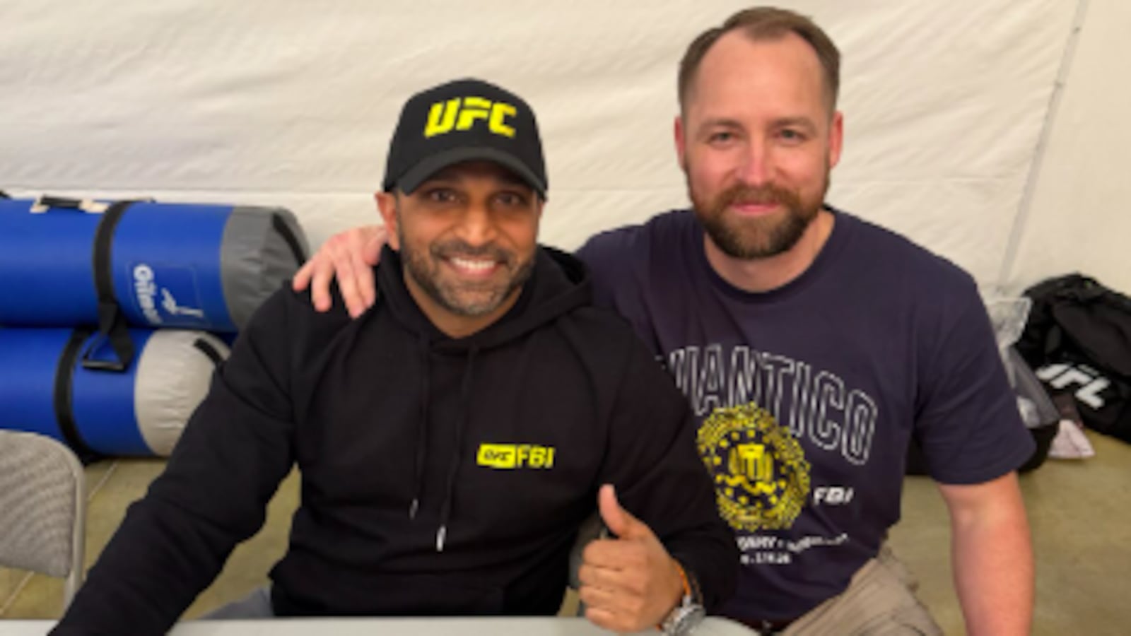Patel signed photos of himself at an FBI-UFC training event over the weekend.