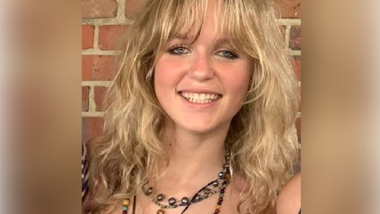 Picture of Jillian Ludwig in front of brick wall