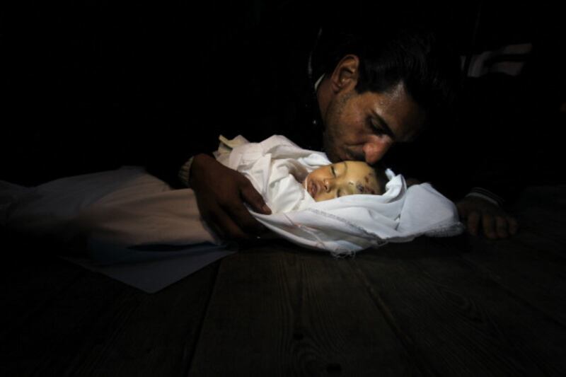 articles/2012/11/21/our-deaths-don-t-count-for-more/fatherdaughtergaza_vif1ru