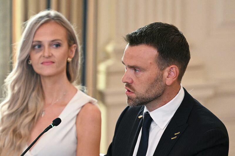 Right-wing political activist Jack Posobiec speaks next to journalist Katie Daviscourt during a roundtable about Antifa in the State Dining Room of the White House