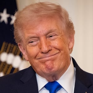 WASHINGTON, DC - FEBRUARY 23: President Donald Trump listens as Laura Wilkerson speaks during the Angel Families Remembrance Ceremony in the East Room of the White House in Washington, DC on February 23, 2026. (Photo by Nathan Posner/Anadolu via Getty Images)