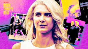 Natalie Harp stands in front of pictures of her and Donald Trump