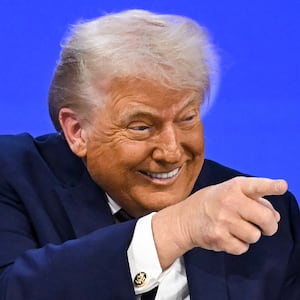 TOPSHOT - US President Donald Trump gestures as he speaks at the "Board of Peace" meeting during the World Economic Forum (WEF) annual meeting in Davos on January 22, 2026. US President Donald Trump will show off his new "Board of Peace" at Davos on January 22, 2026 burnishing his claim to be a peacemaker a day after backing off his own threats against Greenland. Originally meant to oversee the rebuilding of Gaza after the war between Hamas and Israel, the board's charter does not limit its role to the Strip, and has sparked concerns that Trump wants it to rival the United Nations. (Photo by Fabrice COFFRINI / AFP via Getty Images)