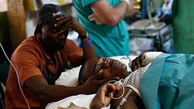 cheats/2010/02/24/emergency-doctors-leave-haiti-nbsp/doctors-leaving-haiti-patient_flmzgr