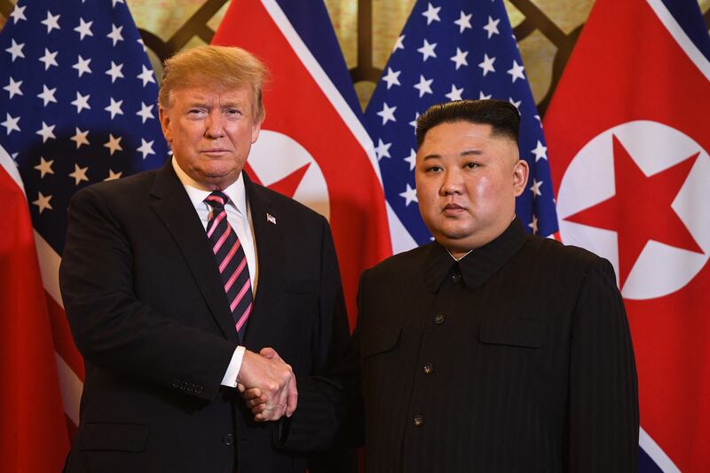 US President Donald Trump (L) shakes hands with North Korea's leader Kim Jong Un before a meeting at the Sofitel Legend Metropole hotel in Hanoi on February 27, 2019.