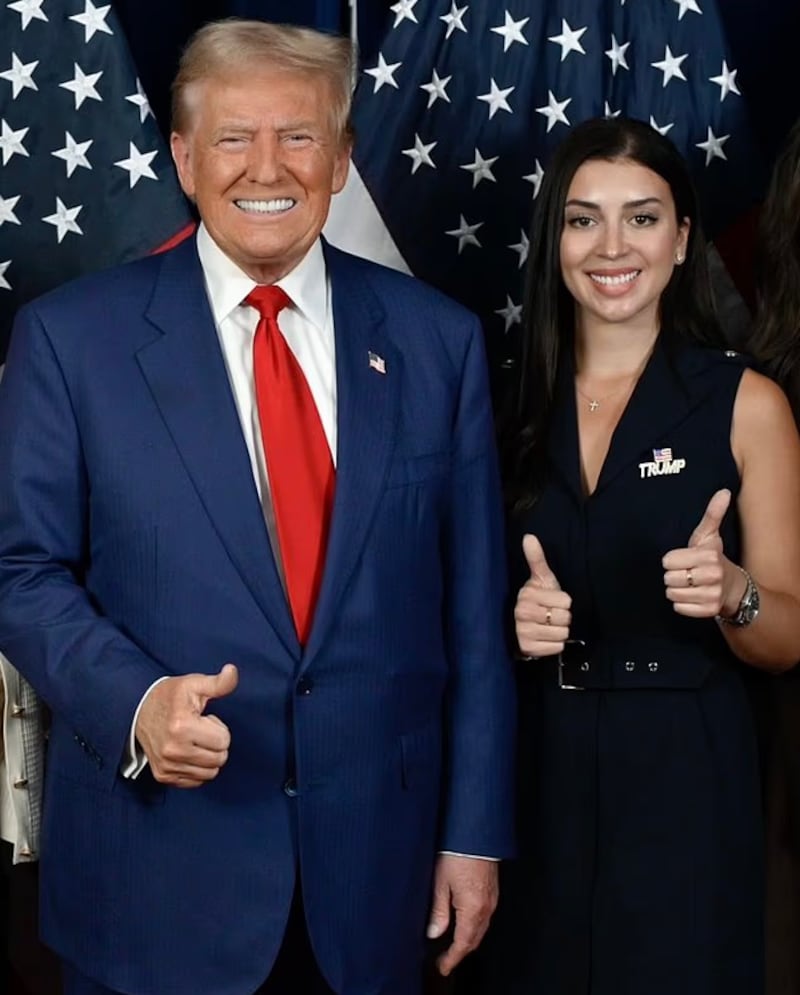 A photo of Julia Varvaro posing with Donald Trump.