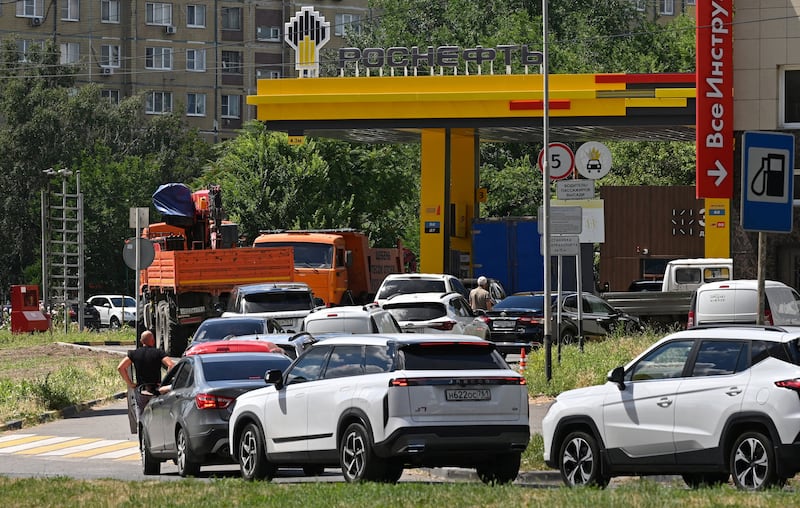 Vehicles queue to refuel in Russia