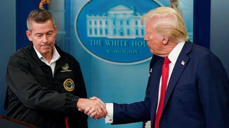U.S. President Donald Trump greets Transportation Secretary Sean Duffy as they speak to reporters about Wednesday's deadly midair collision between a U.S. Army Black Hawk helicopter and American Eagle flight 5342 near Ronald Reagan Washington National Airport, in the Brady Press Briefing Room at the White House in Washington, U.S., January 30, 2025. REUTERS/Elizabeth Frantz