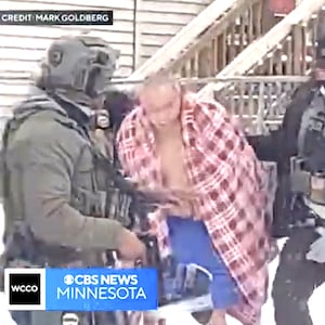 ChongLy “Scott” Thao is dragged of his house, wearing just underwear, by ICE agents into the snow.