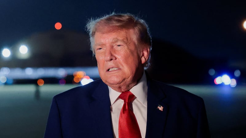 U.S. President Donald Trump speaks to members of the media after disembarking Air Force One at Joint Base Andrews, Maryland, U.S., August 11, 2026.