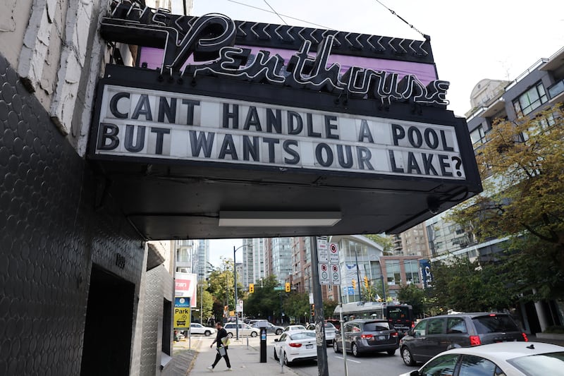 A sign reading "Can’t handle a pool but wants our lake?" is displayed outside The Penthouse Nightclub, in reference to U.S. President Donald Trump renaming Lake Ontario as "Lake America", in Vancouver, British Columbia, Canada August 31, 2026. REUTERS/Chris Helgren