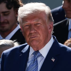 U.S. President Donald Trump holds a World Series ring, while hosting a reception for the reigning Major League Baseball (MLB) World Series champion Los Angeles Dodgers in the Rose Garden at the White House, Washington, D.C., U.S., July 23, 2026. REUTERS/Evelyn Hockstein