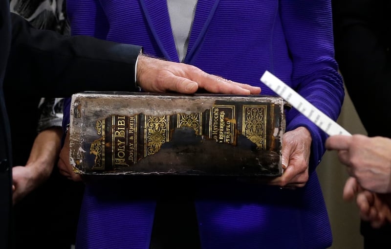 TOPSHOT - US Vice President Joe Biden (L) places his hand on the Biden family Bible held by his wife Jill Biden as he takes the oath of office from Supreme Court Justice Sonia Sotomayo during and official ceremony at the Naval Observatory on January 20, 2013 in Washington.
