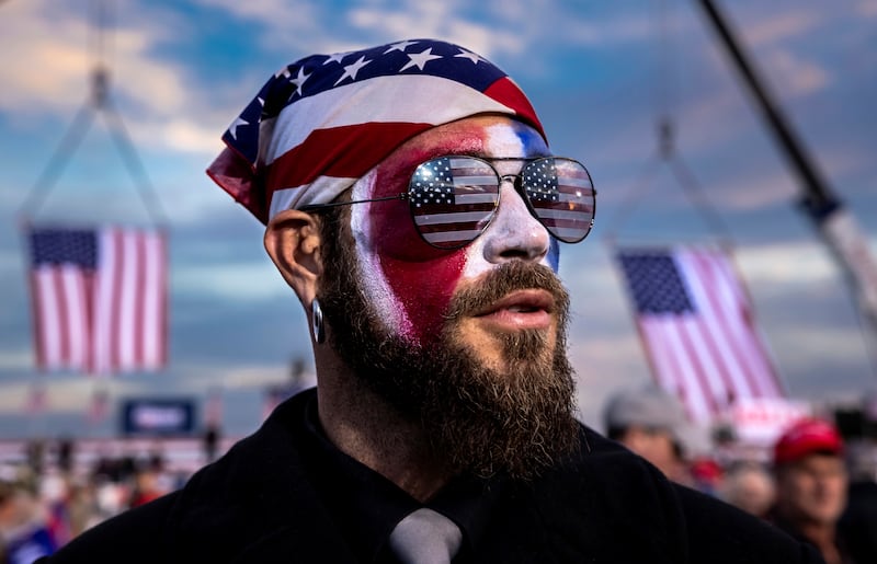 Jacob Anthony Angeli Chansley is seen at a Trump rally on January 4, 2021 in Dalton, Georgia. Chansley, known as the QAnon Shaman, attended the Capitol riots on the 6th of January in Washington, DC. On January 9, Chansley was arrested on federal charges of "knowingly entering or remaining in any restricted building or grounds without lawful authority, and with violent entry and disorderly conduct on Capitol grounds" Trump supporters clashed with police and security forces as people stormed the US Capitol on January 6, 2021 in Washington, DC.