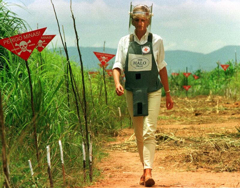 Diana, Princess of Wales is seen in this January 15 1997 file picture walking in one of the safety corridors of the land mine fields of Huambo, Angola during her visit to help a Red Cross campaign to outlaw landmines worldwide.