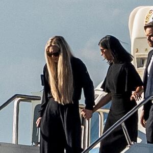 U.S. Vice President JD Vance, his wife Usha Vance and wife of slain conservative activist Charlie Kirk, Erika Frantzve, exit Air Force Two, which is carrying the body of Kirk, as the aircraft lands at the airport in Phoenix, Arizona, U.S., September 11, 2025, one day after Kirk was fatally shot during an event at Utah Valley University. REUTERS/Thomas Machowicz/File Photo