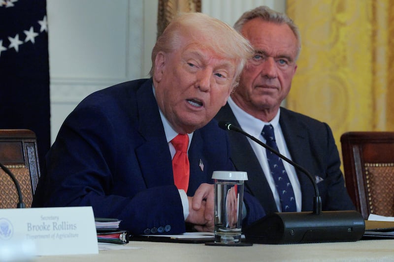WASHINGTON, DC - MAY 22: U.S. President Donald Trump and Health and Human Services Secretary Robert F. Kennedy Jr. attend an event introducing a new Make America Healthy Again Commission report in the East Room of the White House on May 22, 2025 in Washington, DC. The commission, which is tasked with studying the potential causes for the "childhood chronic disease crisis," recommends reassessing the nation’s childhood vaccine schedule, scrutinizing ultra-processed foods and studying pesticides used in commercial farming. The Trump administration has proposed a FY2026 budget of $94 billion for the Department of Health and Human Services -- a reduction of about 26-percent from the 2025 level -- cutting programs and staff at the National Institutes of Health and the Centers for Disease Control and Prevention. (Photo by Chip Somodevilla/Getty Images)