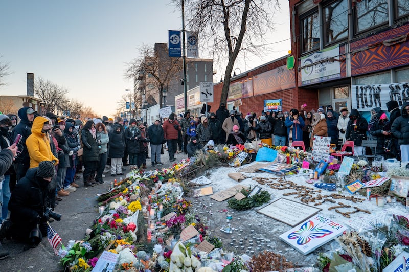People pay their respects at a memorial site for Alex Pretti on January 25, 2026 in Minneapolis, Minnesota. Pretti was shot and killed by federal agents amid a scuffle to arrest him on January 24.