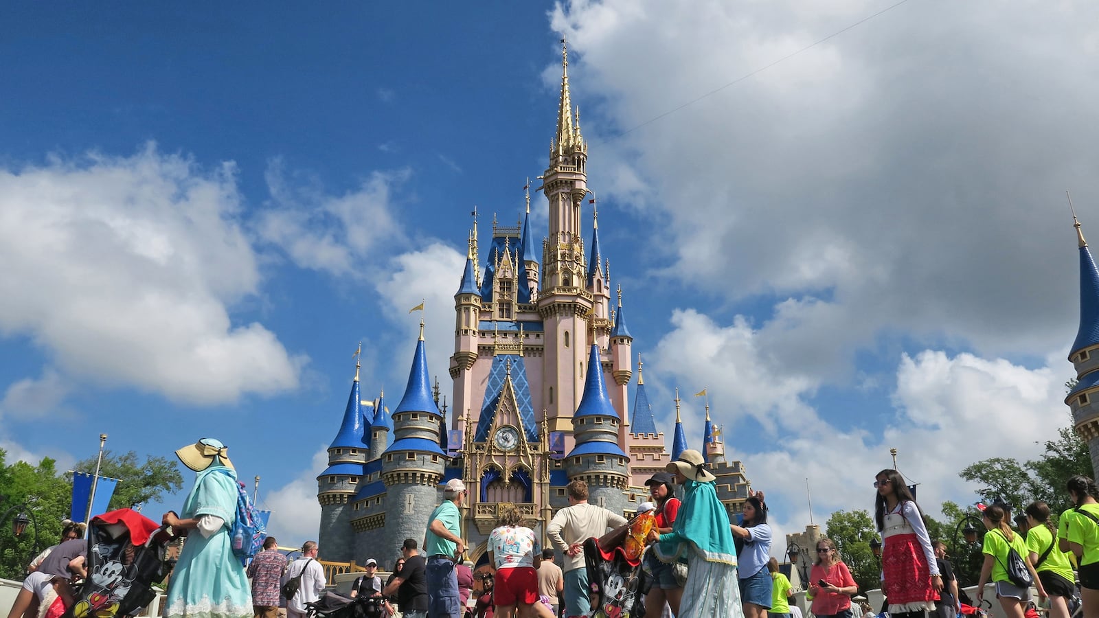 Guests walk past Cinderella Castle at the Magic Kingdom in Walt Disney World on April 2, 2025.