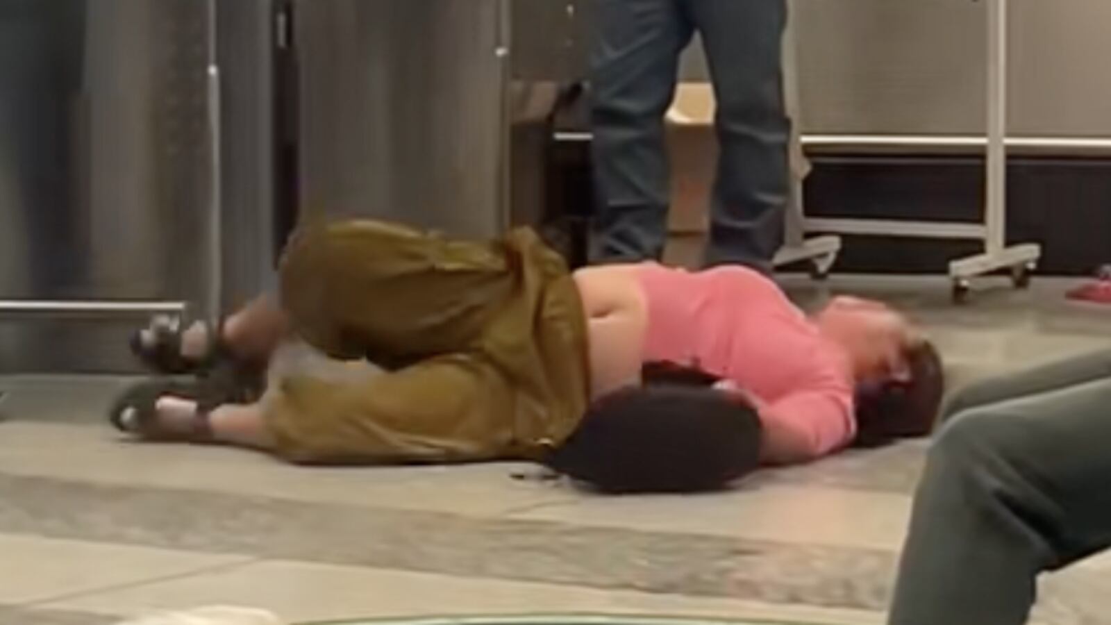 The middle-aged lady was perturbed by gate staff at Milan Malpensa Airport telling her that her baggage was too heavy.