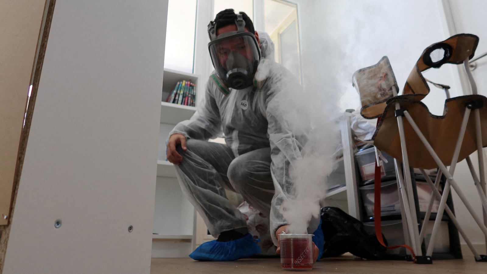 Sacha Krief treats an apartment against bedbugs in Paris, France