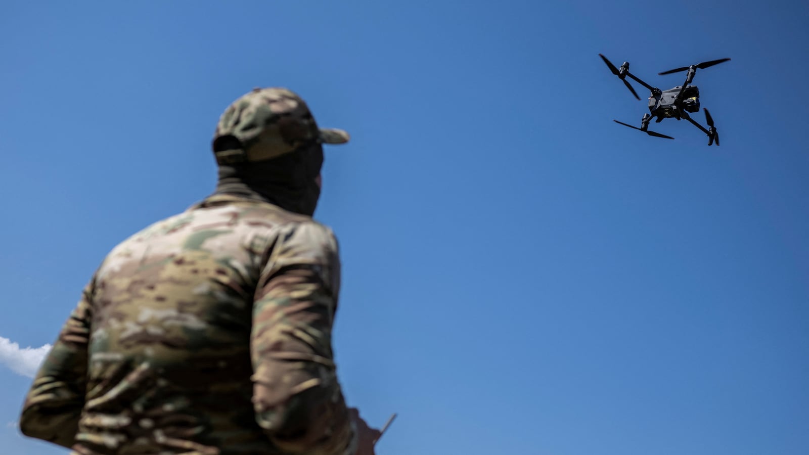 A Ukrainian serviceman operates a drone during a training in Zaporizhzhia region, Ukraine, Aug. 17, 2023.