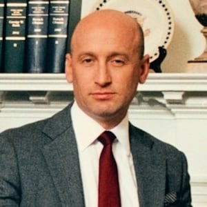 White House Deputy Chief of Staff Stephen Miller awkwardly perched on the edge of a table for a group photo.