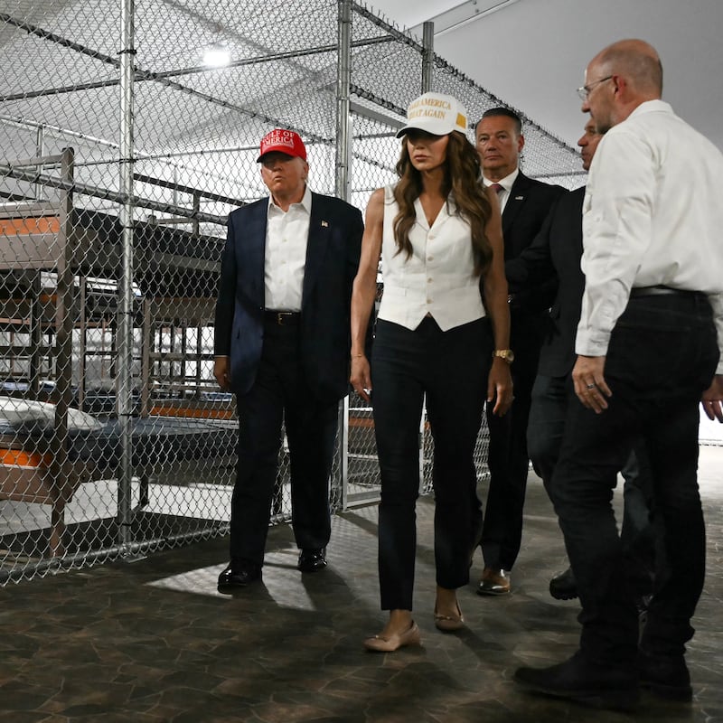 US President President Donald Trump (L), Florida Governor Ron DeSantis (2nd-R), and Secretary of Homeland Security Kristi Noem (2nd-L) tour a migrant detention center, dubbed "Alligator Alcatraz," located at the site of the Dade-Collier Training and Transition Airport in Ochopee, Florida on July 1, 2025. President Trump is visiting a migrant detention center in a reptile-infested Florida swamp dubbed "Alligator Alcatraz." Trump will attend the opening of the 5,000-bed facility -- located at an abandoned airfield in the Everglades wetlands -- part of his expansion of deportations of undocumented migrants, his spokeswoman said. (Photo by ANDREW CABALLERO-REYNOLDS / AFP) (Photo by ANDREW CABALLERO-REYNOLDS/AFP via Getty Images).