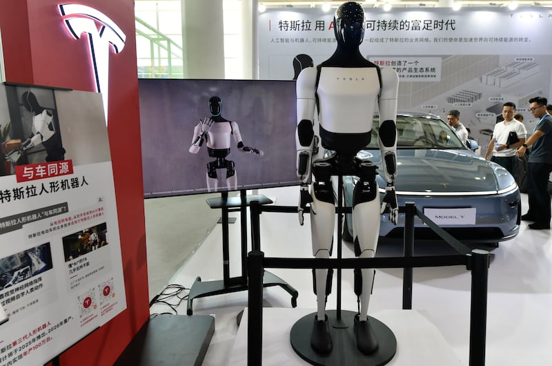 Optimus, also known as Tesla Bot, is on display during the 25th China International Fair for Investment & Trade