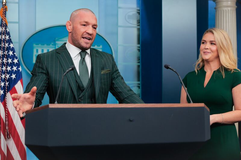 WASHINGTON, DC - MARCH 17: Former UFC champion and Irish businessman Conor McGregor briefly speaks with reporters alongside White House Press Secretary Karoline Leavitt before meeting with President Donald Trump in the Brady Press Briefing Room at the White House on Saint Patrick's Day, March 17, 2025 in Washington, DC. McGregor said he is meeting with Trump to talk about how Ireland is losing its identity to immigrants, among other topics. (Photo by Chip Somodevilla/Getty Images)