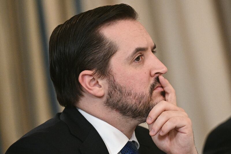White House Deputy Chief of Staff Taylor Budowich listens during an "Invest America" roundtable discussion with US President Donald Trump in the State Dining Room of the White House in Washington, DC on June 9, 2025. (Photo by Brendan SMIALOWSKI / AFP) (Photo by BRENDAN SMIALOWSKI/AFP via Getty Images)