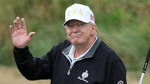 BALMEDIE, SCOTLAND - JULY 29: U.S. President Donald Trump holds a driver after teeing off during the opening of his new golf course at his Trump International Golf links resort on July 29, 2025 in Balmedie, Scotland. President Trump is visiting Scotland in a trip that’s part-vacation, part-work, as he stayed at his Trump Turnberry golf course, followed by Trump International Golf Links in Aberdeenshire, between July 25 to 29. (Photo by Jeff J Mitchell/Getty Images)