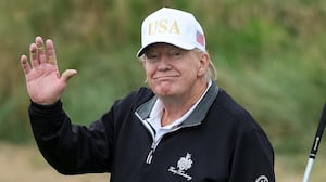 BALMEDIE, SCOTLAND - JULY 29: U.S. President Donald Trump holds a driver after teeing off during the opening of his new golf course at his Trump International Golf links resort on July 29, 2025 in Balmedie, Scotland. President Trump is visiting Scotland in a trip that’s part-vacation, part-work, as he stayed at his Trump Turnberry golf course, followed by Trump International Golf Links in Aberdeenshire, between July 25 to 29. (Photo by Jeff J Mitchell/Getty Images)