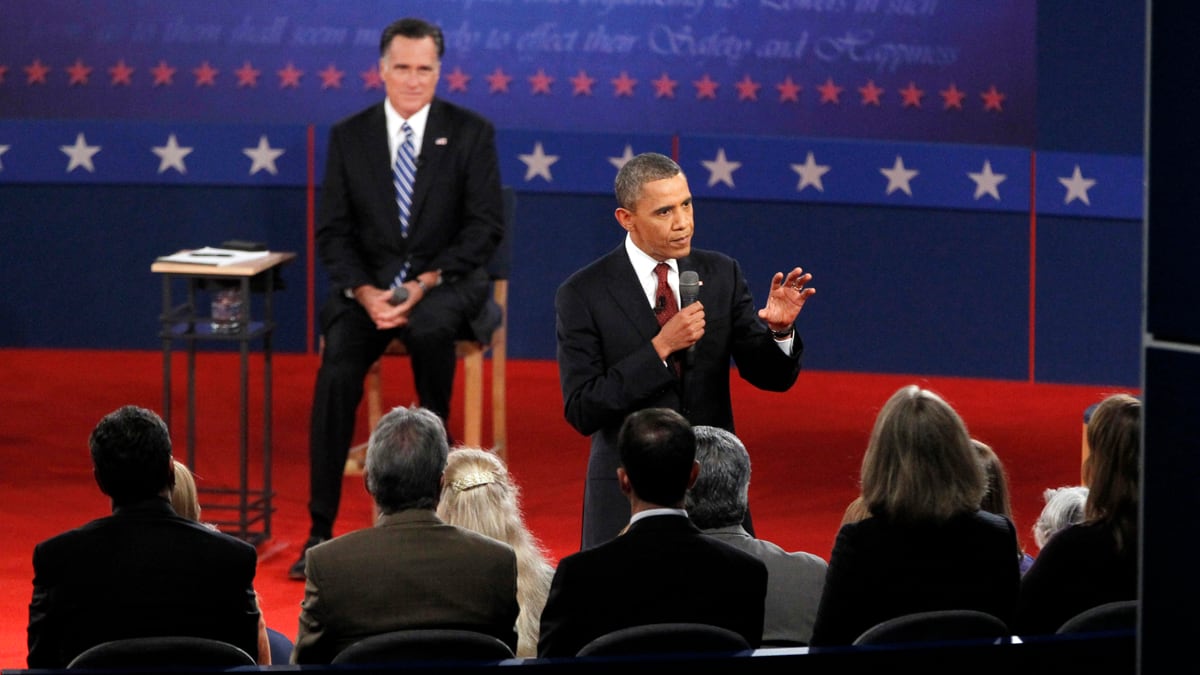articles/2012/10/17/obama-wins-second-debate-but-romney-scores-with-centrist-likable-storyline/crowd-watches-barack-mitt-background_j1dghs